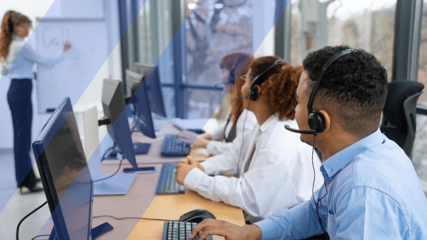 call center agents attentively listening to a trainer