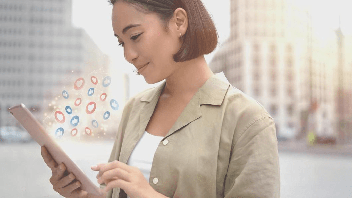 An asian woman holding a tablet