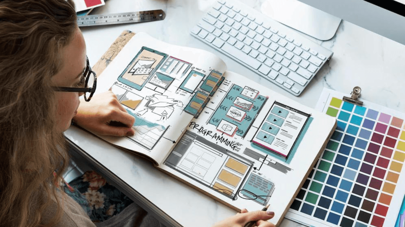 A web designer looking at the web design brand book