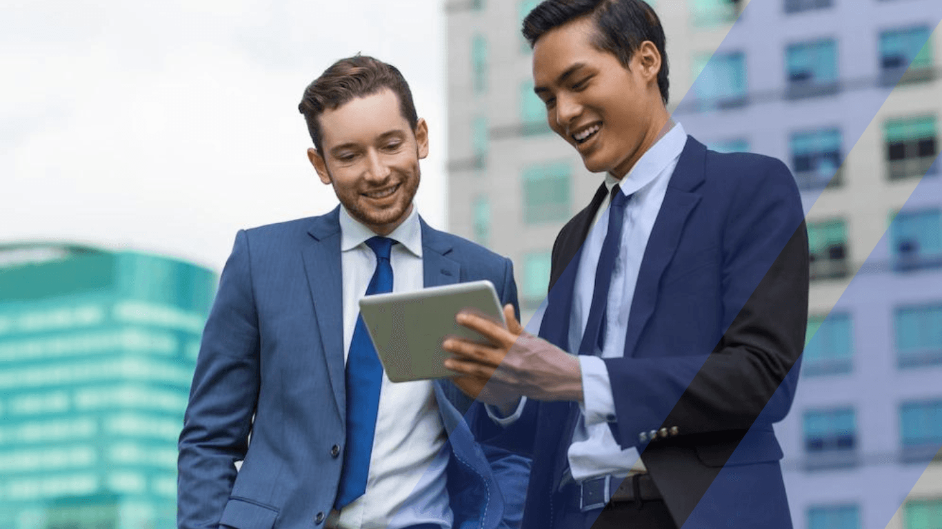 Two male professionals discussing with a tablet