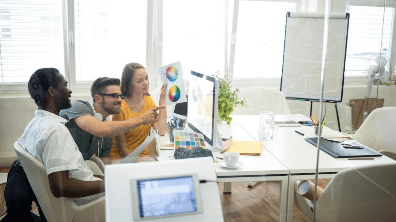 A group of graphic designers working on a web design