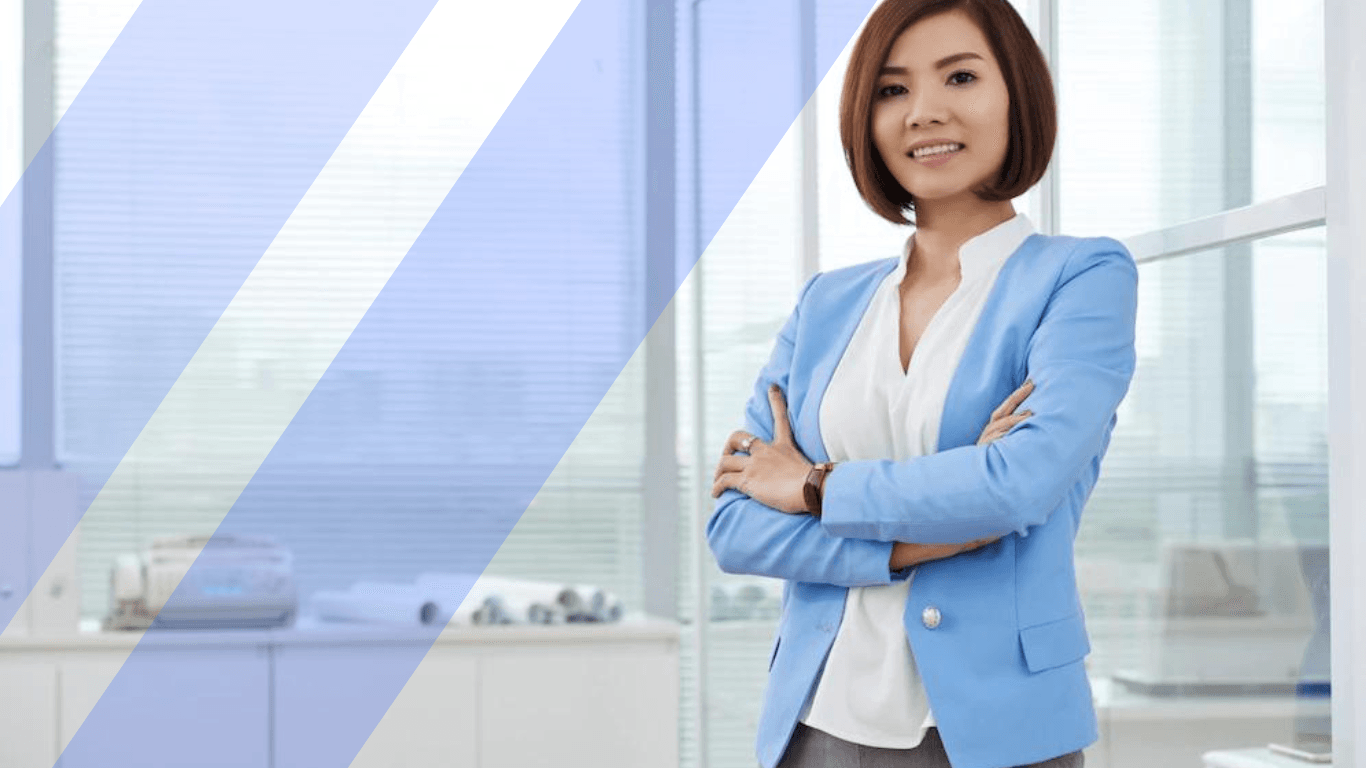A woman standing in a corporate attire